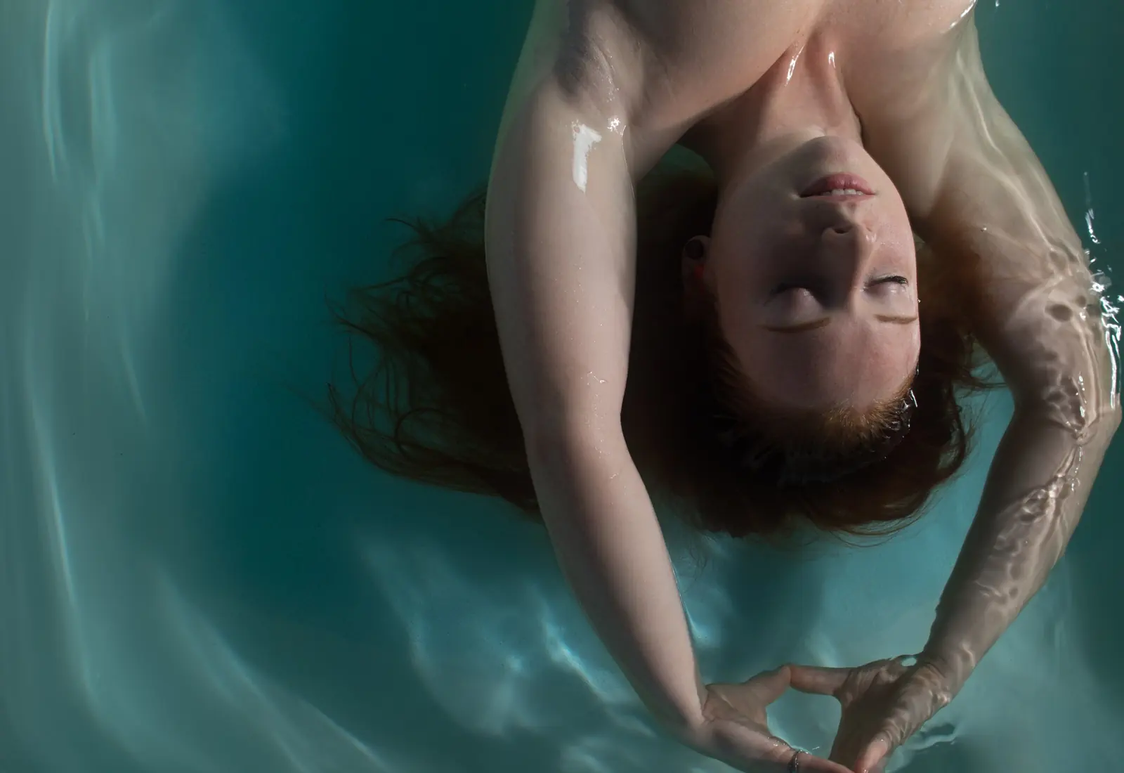 A guest floating in turquoise water